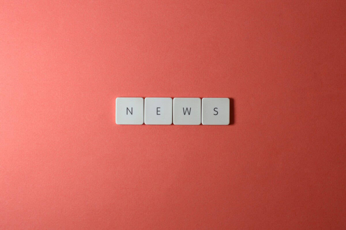 The word NEWS using Scrabble tiles
